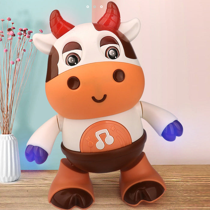White and brown cow dance robot toy with orange face, big eyes, and glowing belly light