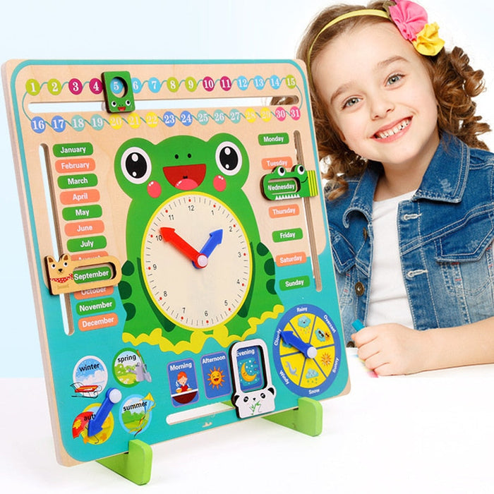 Green wooden kids calendar clock with frog face, calendar dates, and analog clock hands
