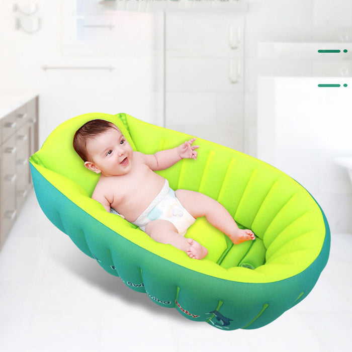 Inflatable baby bath tub in green with teal outer rim, molded support for newborns