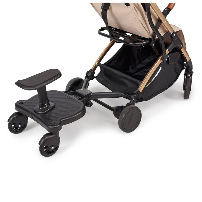 Stroller buggy board with padded standing platform, support bar, and four caster wheels