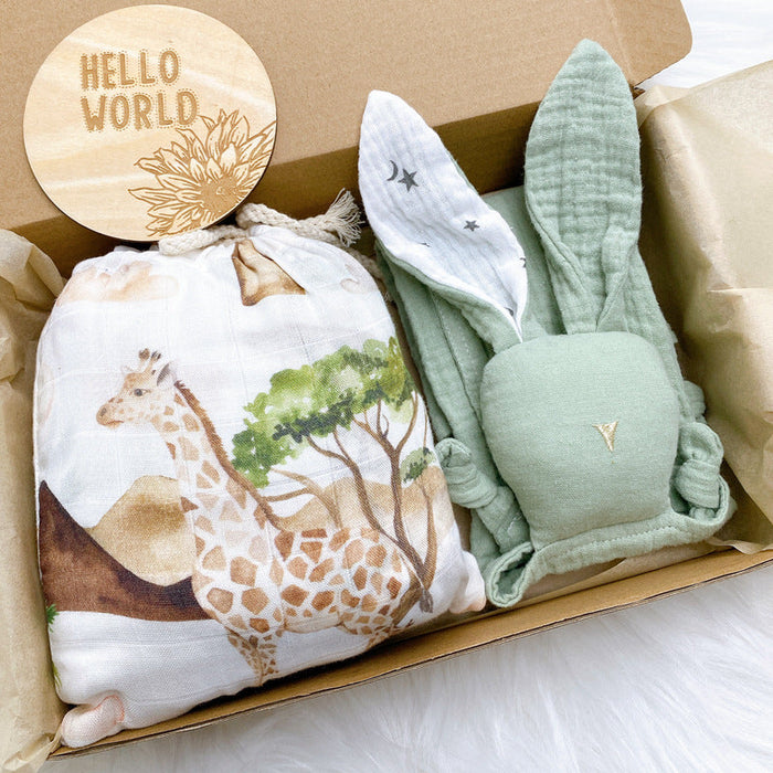 Baby crib fitted sheet set with giraffe all-over print in white and sage green