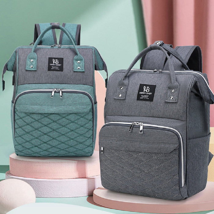 Baby diaper bag in gray with front zipper pocket and top handles, teal side straps
