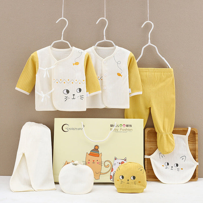 Baby clothing gift box set with yellow pants, white tops, and cat-themed accessories