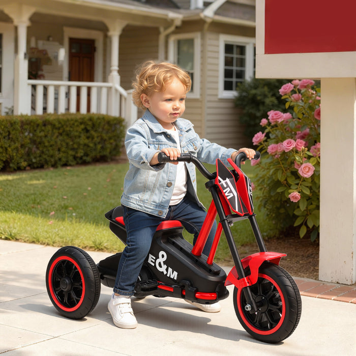 Red and black kids tricycle with three wheels, pedal drive, and wide seat.
