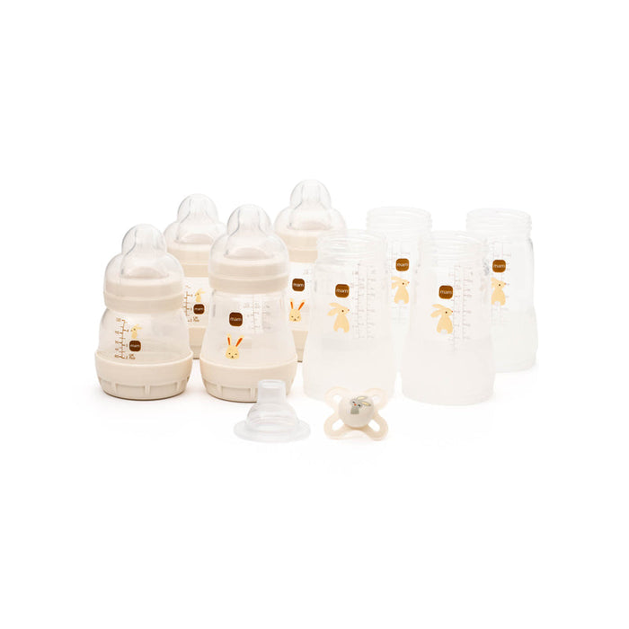 Baby bottle starter set with multiple nipples, caps, and storage bags, neutral