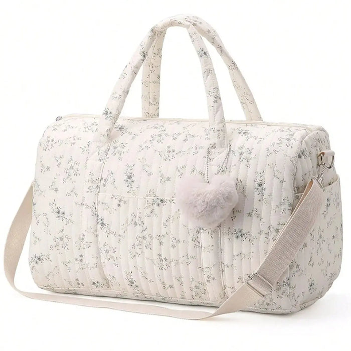 Large floral mommy bag with top handles, pom-pom charm, zipper front pocket, shoulder strap