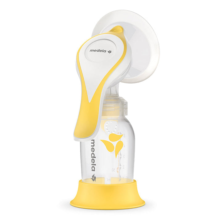 Manual breast pump with yellow-and-white handle and clear collection bottle
