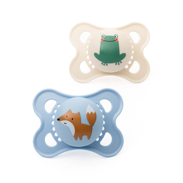 Two MAM Original soothers, one blue with a fox and one cream with a frog design