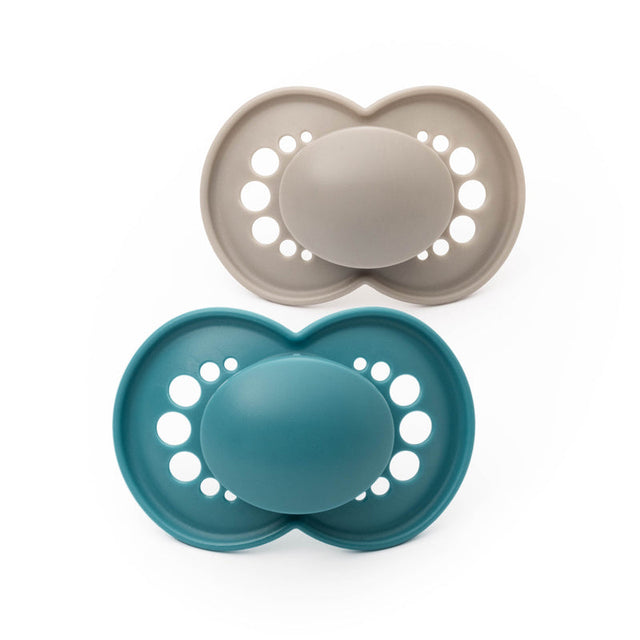 MAM Original soothers, one blue and one pale neutral, with ventilated butterfly-shaped shields.