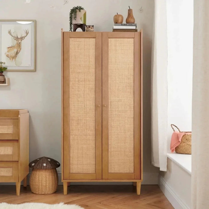 Light oak wardrobe with two woven cabinet doors and tapered wooden legs