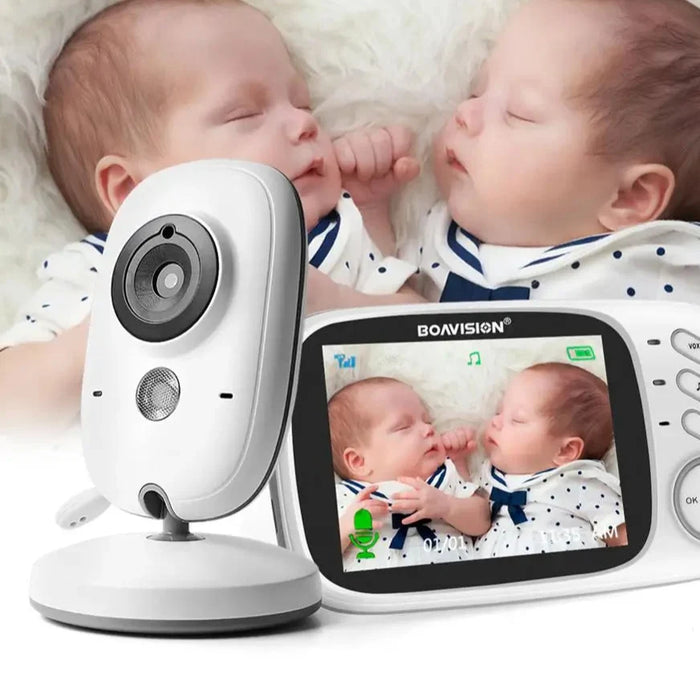 White baby video monitor with camera unit and LCD receiver on a tabletop base