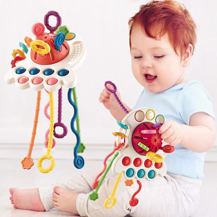 Red octopus finger press push toy with multicolor textured strings and rings