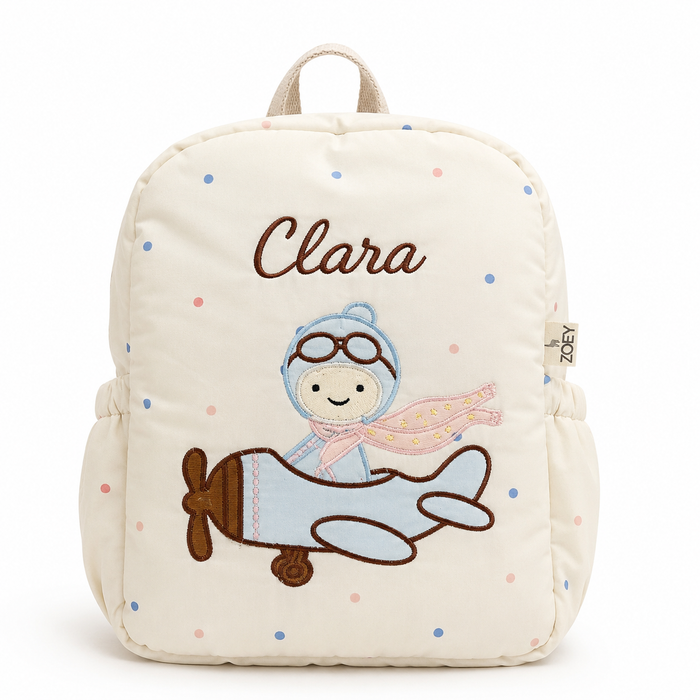 Kids backpack, cream fabric with embroidered pilot and 'Clara' name patch