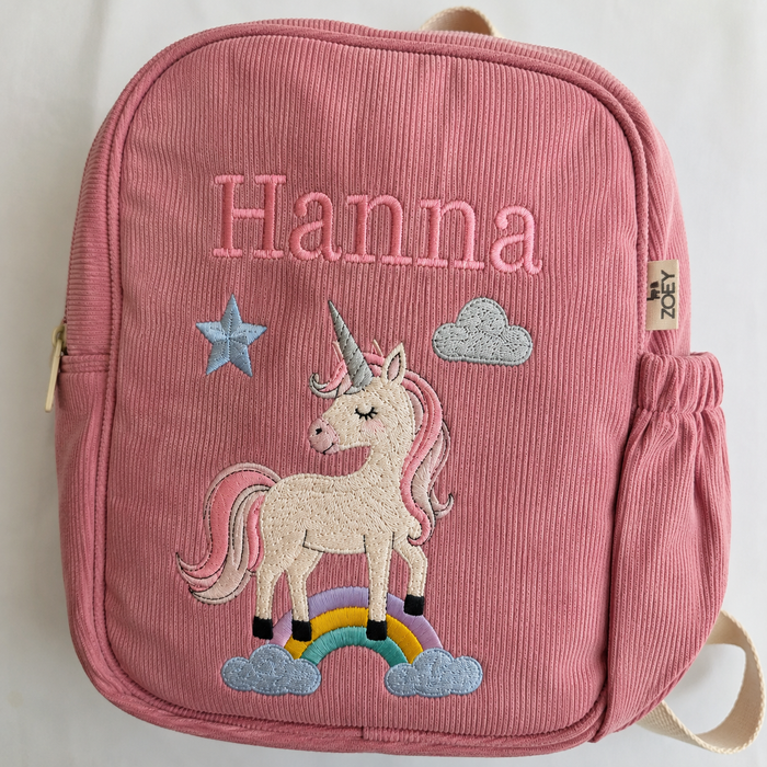 Pink corduroy mini bag with unicorn applique, rainbow and stars, front zipper pocket
