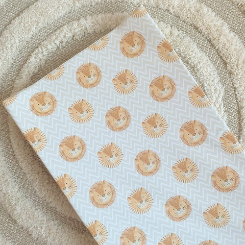 Anti-roll changing wedge mat with light blue zigzag pattern and lion face print