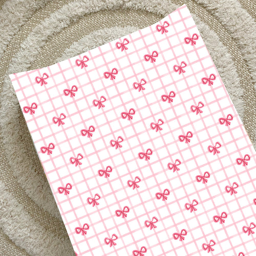 Pink bow anti-roll wedge baby changing mat with red check grid pattern