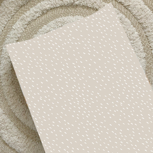 Anti-roll changing wedge mat with light greige dash print, smooth fabric surface