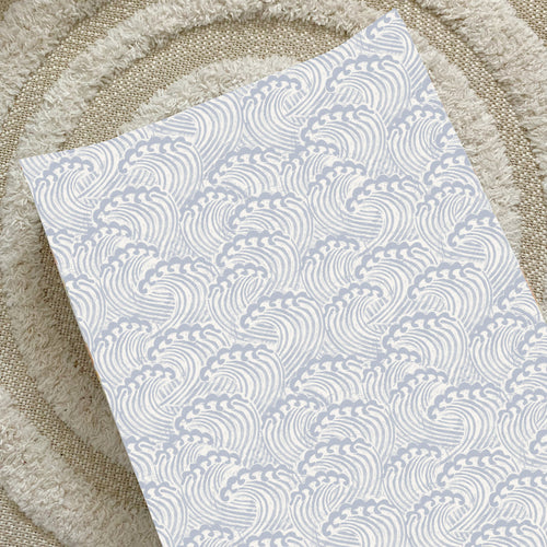 Anti-roll changing mat wedge with light blue wave print, rectangular top