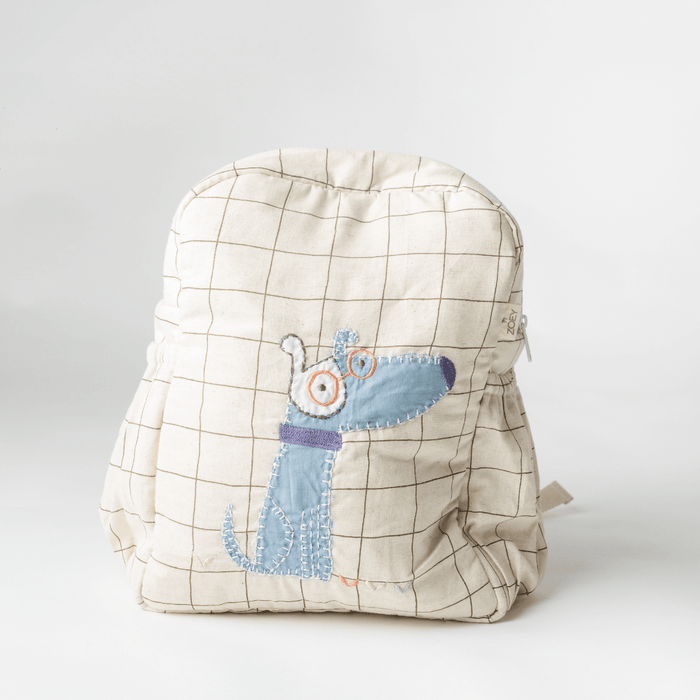 Cream grid kids backpack with blue dog applique