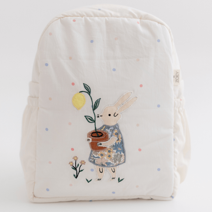 Kids white canvas backpack with embroidered bunny and colorful polka-dot pattern